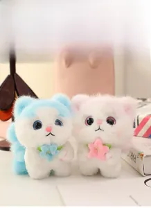 Detail view of plush angel cat toys in pink and blue with sparkly eyes and soft faux fur