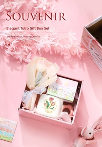 Close-up of pink tulip ceramic mug with matching floral gift box set for souvenir