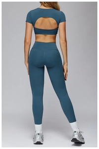 Detail of cross-back hollow design and high-waist fitness leggings in navy blue