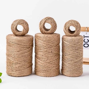 Natural jute twine rolls for cake decoration and flower bouquets in minimalist style