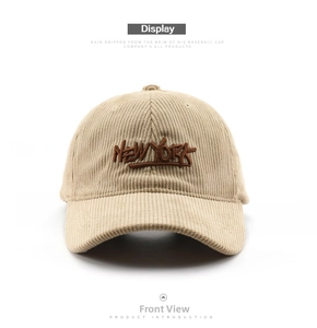 Front view of beige corduroy baseball cap with brown New York embroidery text