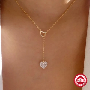 Elegant S925 sterling silver gold double heart pendant necklace worn by a model