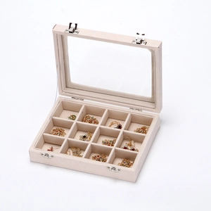 Beige 12-slot jewelry box with clear top and metal buckles for jewelry storage
