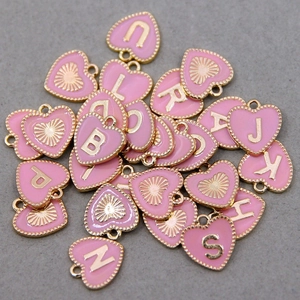 Pink heart alphabet charms with gold metal frame and enamel finish for jewelry making
