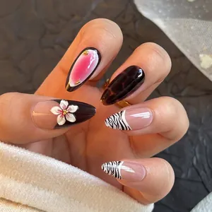 French zebra pattern press-on nails with 3D floral carvings and black leopard marbling