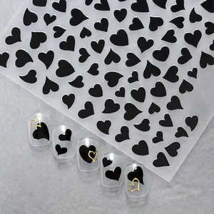 Elegant black and gold heart nail stickers set with stylish sample tips for DIY manicure