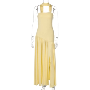 Detail view of the yellow backless maxi dress featuring a high side slit and neck tie