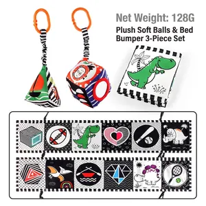 Black and white high contrast baby soft cloth book with dinosaur and geometric patterns