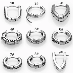 Collection of nine vintage silver stainless steel hoop earrings with punk star and gothic patterns