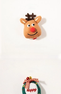 Detail of plush reindeer antler hairpin and embroidered happy wreath Christmas hair accessories