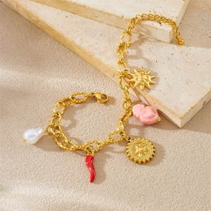 Bracelet chaîne en acier doré avec breloques soleil, fleur et perles sur pierres