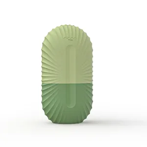 Silicone facial ice roller mold in two-tone green capsule design with pleated texture