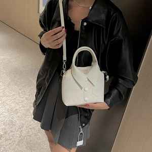 White PU leather handbag featuring unique shirt collar design with adjustable strap