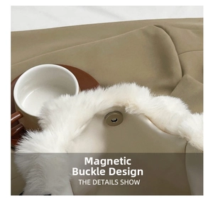 Detailed close-up of the secure metal magnetic closure on a soft white plush tote bag