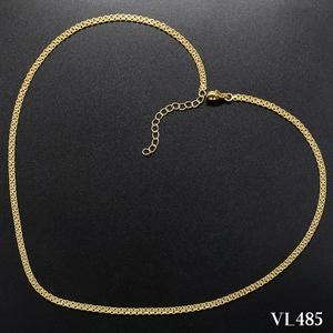 Detail of gold water wave chain with lobster clasp and adjustable links on black background
