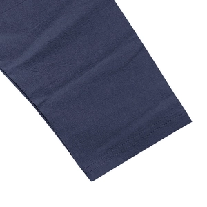 Detailed macro view of blue linen shirt cuff showing high quality double stitching