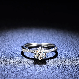 Moissanite ring with twisted vine band and brilliant round cut center diamond