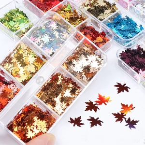 6-grid box of 6mm holographic maple leaf nail sequins in vibrant metallic colors