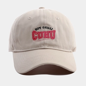 Detailed embroidery on a beige cotton baseball cap with Hot Chilli and CUHU text lettering