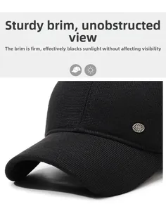 Macro view of a black wool baseball cap featuring a stiff brim and metal emblem detail