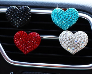Sparkling rhinestone heart-shaped car air vent clips in black, blue, red, and white
