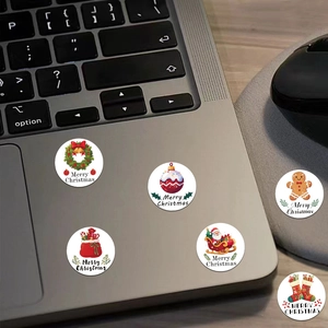 Roll of 500 Christmas cartoon stickers for laptops and gifts featuring Merry Christmas text