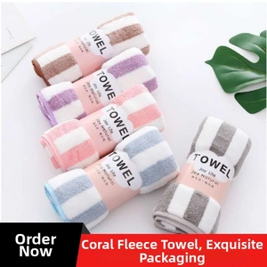 Close-up of microfiber towels in five colors with classic striped patterns and gift bands