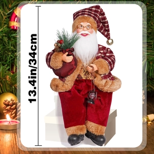 Detail of 13.4in Santa figure with red plaid suit holding a lantern and gift bag