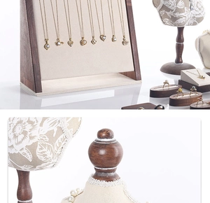 Walnut wood jewelry display set featuring linen busts and necklace stands for retail setup