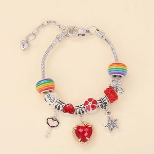 Detail of silver snake chain bracelet with heart pendants and rainbow beads