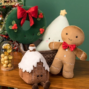 Cozy Christmas plush pillow collection with gingerbread man and wreath in a woven basket