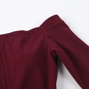 Close-up of shoulder seam and off-the-shoulder neckline on burgundy dress