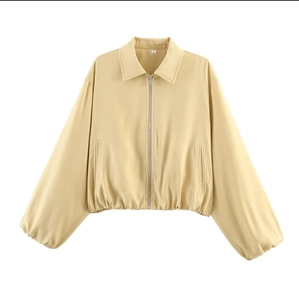 Veste zippée jaune clair à plat avec manches bouffantes et taille élastiquée