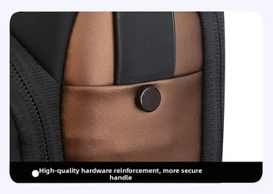 Detail of reinforced black rivet hardware on the brown nylon shoulder bag handle