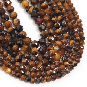 Close-up of faceted natural tiger eye stone beads with golden luster for DIY jewelry