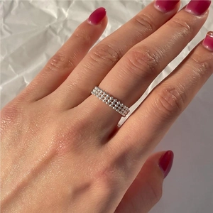Elegant 925 sterling silver three-row beaded ring shown on hand with minimalist style