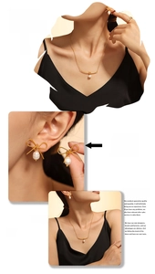 Detail view of gold bow freshwater pearl necklace and earring set on model display