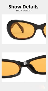 Close-up of black sunglasses frame with orange lenses and integrated nose pads