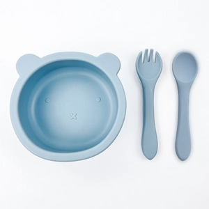 Cartoon bear-shaped silicone baby feeding set with suction bowl, fork, and spoon in light blue