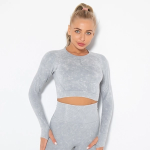 Detail of grey acid wash yoga set featuring long sleeve crop top and high waist leggings