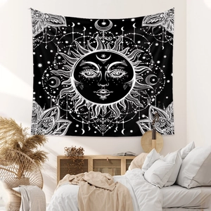 Detail of bohemian sun and moon tapestry in a cozy bedroom with warm natural lighting