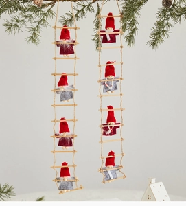 Detail of hanging wooden ladders with eight plush gnomes for Christmas tree decoration