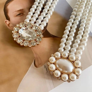 Elegant multi-layer pearl waist chain with crystal-encrusted oval pendants and gold base