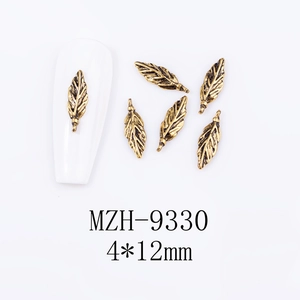 Detailed view of antique gold feather alloy nail art charms in 4x12mm size