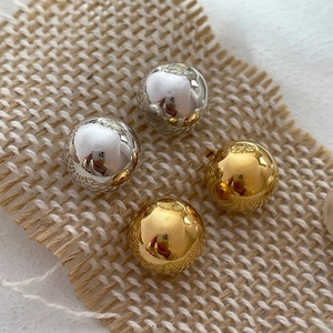 French style S925 sterling silver ball earrings in gold and silver finish on jute cloth