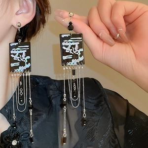 Detail view of New Chinese style tassel earrings with vintage clouds and black beads