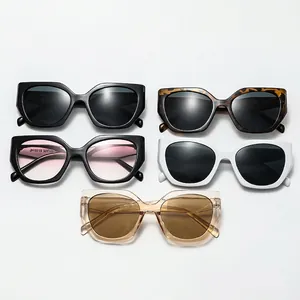 Group of retro cat eye oversized sunglasses in black, white, pink and tortoise finishes