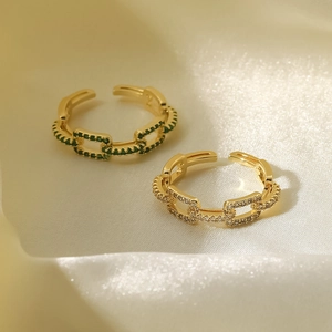 18k gold plated adjustable rings with green and white gemstones on silk