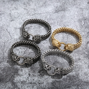 Punk style lion head bracelets in gold and silver steel with chunky metal chain links