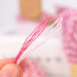 Close-up of pink and white 1.5mm twisted cotton twine for DIY gift wrapping and crafts